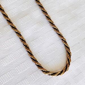 Elegant Gold and Black Twisted Necklace